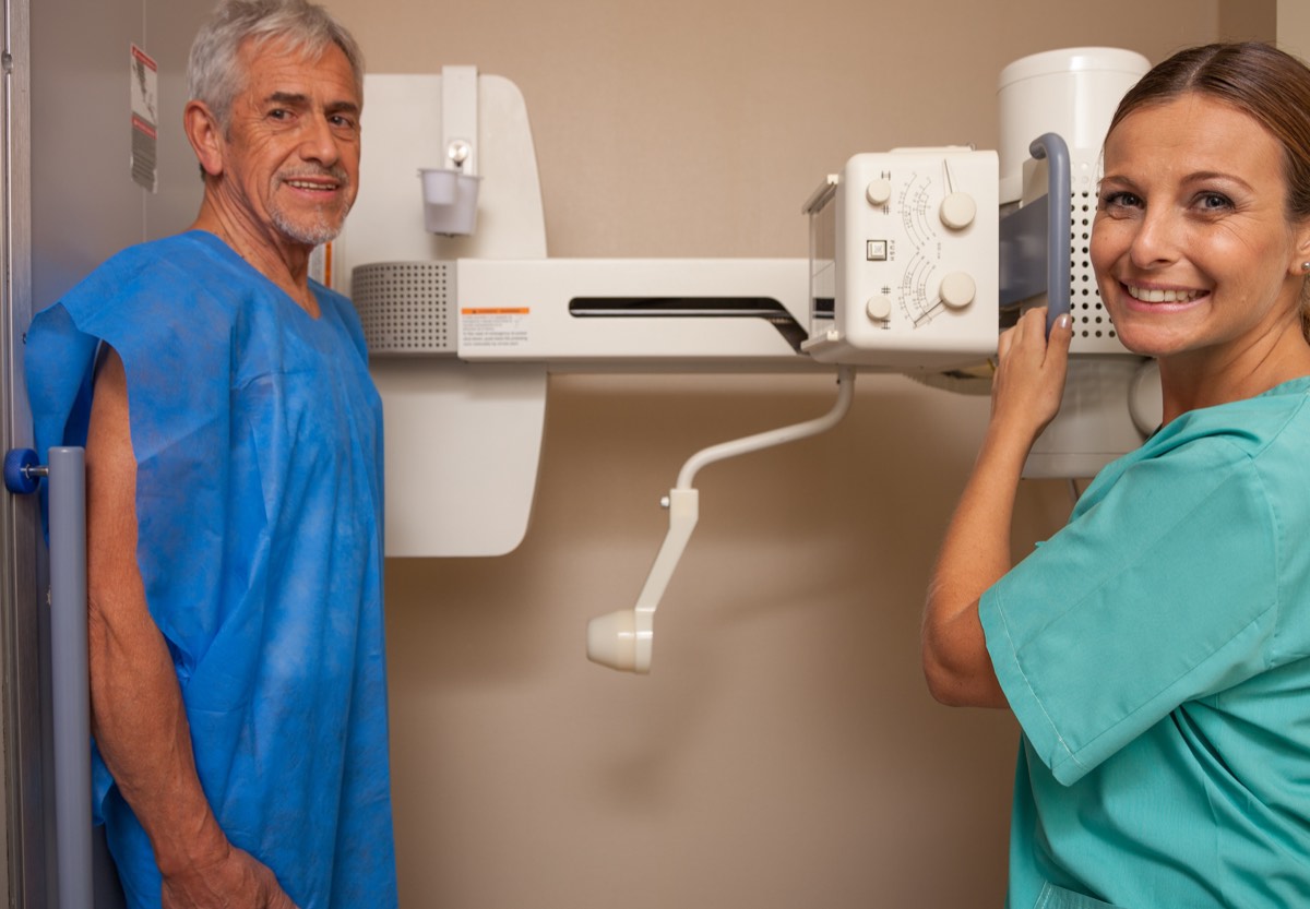 Patient and technologist at a digital X-ray suite served by MDS
